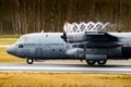 Royal Netherlands Air Force Lockheed C-130 Hercules transport plane taking off from Eindhoven Airbase. The Netherlands - March 16 Royalty Free Stock Photo