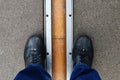 Feet astride the Prime Meridian line in Greenwich