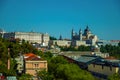 Royal Palace and Almudena Cathedral with buildings among trees in Madrid Royalty Free Stock Photo