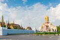 Royal Palace in Bangkok behind a white stone fence