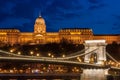 Royal Palace or the Buda Castle and the Chain Bridge after sunset in Budapest in Hungary Royalty Free Stock Photo