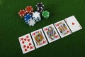Royal straight flush and poker chips Royalty Free Stock Photo