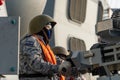 Royat Thai Navy gunner prepare to shoot 0 millimeter automated small calibre machine gun mounted on the frigate