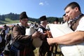 Rhodope bagpipers playing tunes on a Rozhen folklore festival in Bulgaria Royalty Free Stock Photo