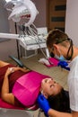 Rozhnyativ, Ukraine, September 15, 2020: patient in the dentist`s office, dental filling, cleaning teeth from tartar, woodpacker