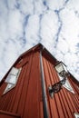 RRed building with a open window and an old fashioned street lamp Royalty Free Stock Photo