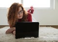 Rred-haired girl with a laptop