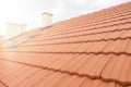 Rroof with new red roofing tiles on residential property. Construction of the roof of the house Royalty Free Stock Photo