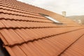 Rroof with new red roofing tiles on residential property. Construction of the roof of the house Royalty Free Stock Photo