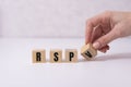 RSVP word made with building blocks on white