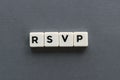 RSVP word made of square letter word on grey background.