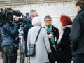 A RTS reporter interviewing a Swiss senior woman peacefully protest Royalty Free Stock Photo