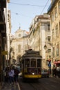 Rua (street) da ConceiÃÂ§ÃÂ£o, downtown Lisbon, Portugal and a yellow tramway
