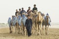 man with his camels in Rub al Khali Desert at the Empty Quarter, in Abu Dhabi, UAE