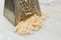 Rub the cheese on an old grater Royalty Free Stock Photo