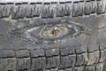 Rubbed wheel of lorry. worn wheel with hole in tire, worn rubber tread to cord