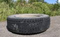 Rubbed wheel of lorry. worn wheel with hole in tire, worn rubber tread to cord