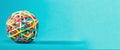 Rubber band ball on blue background Royalty Free Stock Photo