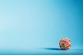 Rubber band ball on blue background Royalty Free Stock Photo