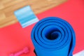 Rubber Band with Red Pilates Mat on Wood Royalty Free Stock Photo