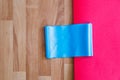 Rubber Band with Red Pilates Mat on Wood Royalty Free Stock Photo