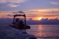 Rubber boat or dinghy dock on the floating pier early morning beautiful sunrise Royalty Free Stock Photo