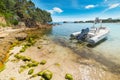 Rubber boat moored in a small cove Royalty Free Stock Photo