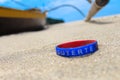 Rubber bond bracelet in the sand