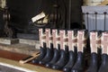 Rubber boots in front of fireplace