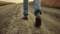 Rubber boots walking rural road closeup at countryside alone. Go away man walker Royalty Free Stock Photo