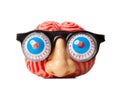 Rubber brain with funny nose and glasses.