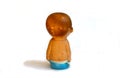 Rubber children`s old toy, little boy sitting on a pot, on a white background