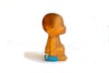 Rubber children`s old toy, little boy sitting on a pot, on a white background