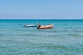 Rubber dinghy floating on the sea near the Larnaca Finikoudes beach of Cyprus Royalty Free Stock Photo