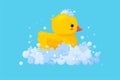 Rubber duck in soap foam with bubbles isolated in blue background. Side view of yellow plastic duckling toy in suds Royalty Free Stock Photo