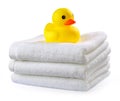 Rubber duck on white towels