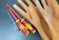 Rubber electric gloves and two screwdrivers Royalty Free Stock Photo