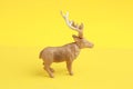 Rubber elk toy isolated on yellow background Royalty Free Stock Photo