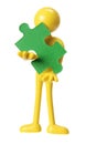 Rubber Figure with Piece of Jigsaw Puzzle Royalty Free Stock Photo