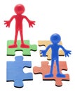 Rubber Figures on Jigsaw Puzzle Pieces Royalty Free Stock Photo