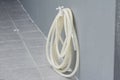 Rubber garden hose hang on the pvc faucet. Royalty Free Stock Photo