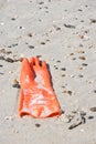 Rubber glove on the beach Royalty Free Stock Photo