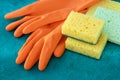 Rubber gloves with colorful kitchen sponges, housekeeping. Cleaning service concept, housework. Dish scrubber Royalty Free Stock Photo