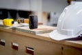 Rubber hammer on wooden table with white antiknock safety helmet and many carpenter tools at workplace, equipment at CNC Royalty Free Stock Photo