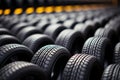 Rubber inventory Close up of bulk car tires in store, tire shop backdrop