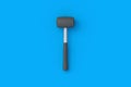Rubber mallet on blue background. Home improvement. Repair tools