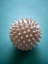 Rubber massage ball on a blue background Royalty Free Stock Photo
