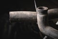 Rubber pipes and hoses leading from the car radiator to the engine, view of the engine from below. old worn rubber car Royalty Free Stock Photo