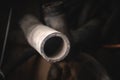 Rubber pipes and hoses leading from the car radiator to the engine, view of the engine from below. old worn rubber car Royalty Free Stock Photo