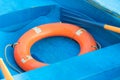 Rubber safety ring on a blue boat